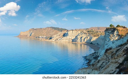 Sandy beach under famed white cliff, called "Scala dei Turchi", in Sicily, near Agrigento, Italy - Powered by Shutterstock