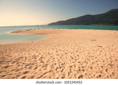 Sandy beach upon the sunset time.