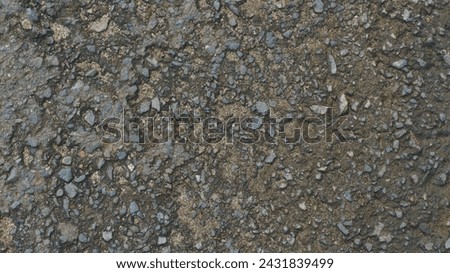 sandy black asphalt gravel texture, natural and industrial theme background with a bold rough texture