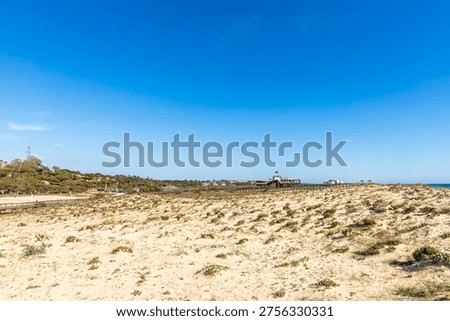  A sandy dune beach in Quinta do Lago, Algarve, Portugal.