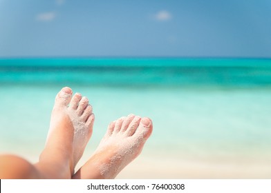 sandy feet on the beach