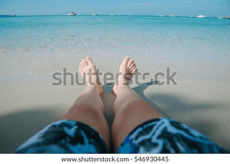 sandy feet on the beach

