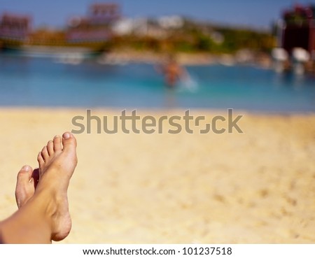 the sandy feet on the beautiful beach