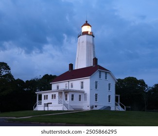 Sandy Hook Lighthouse is seen during twilight in August of 2024