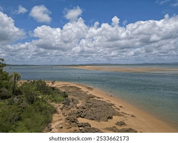 A Sandy lakeside beach in a forested setting with water: Captain Cook's Landing Place, Seventeen Seventy, Queensland, Australia - Powered by Shutterstock