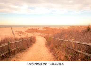 A Sandy Path Leads To The Ocean At Cape May Meadows, NJ, On An Early Spring Morning At Sunrise