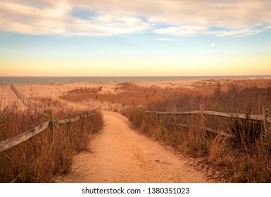 A Sandy Path Leads To The Ocean At Cape May Meadows, NJ, On An Early Spring Morning At Sunrise