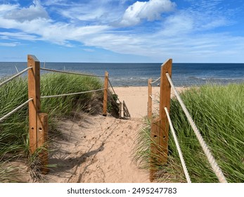 A sandy path through the dunes leads to the magnificent Greenwich Beach on the north shore of Prince Edward Island, Canada 