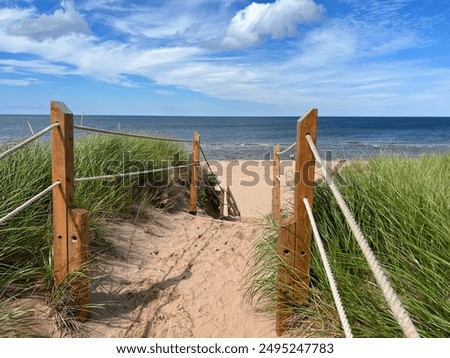 A sandy path through the dunes leads to the magnificent Greenwich Beach on the north shore of Prince Edward Island, Canada 