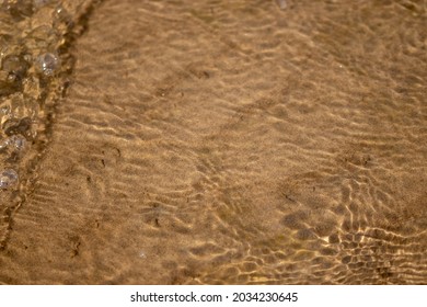 Sandy River Bed Underwater In Shallow Water