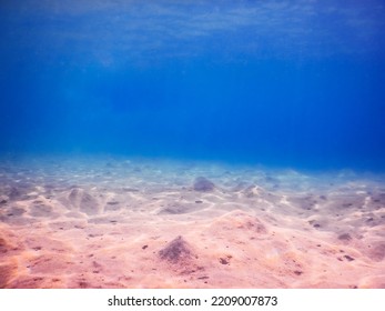 Sandy Seabed Landscape With Deep Blue Water While Diving In The Morning