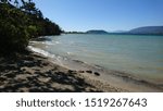 Sandy shores of St. peter Island on Shore of Lake Biel in Switzerland on a sunny day