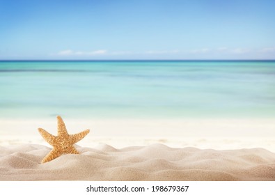 Sandy Summer Beach With Blur Sea On Background