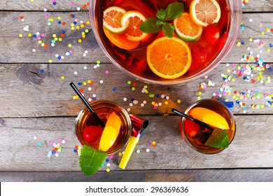 Sangria in bowl and glasses on wooden table close up - Powered by Shutterstock