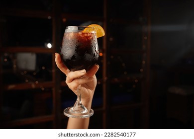 Sangria cocktail with red wine at the bar with blurred background