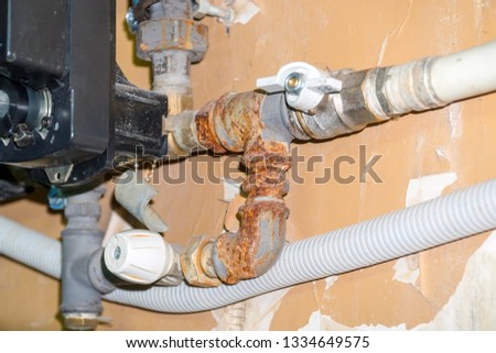 Sanitary engineering. Connection of the supply pump in the home heating system. Connection of plastic pipes through tees fittings. Home heating system, water supply