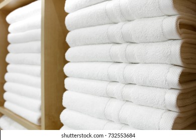 Sanitary prevention antivirus concept. Fresh White Hotel Towels Folded and Stacked on a Shelf - Shutterstock ID 732553684