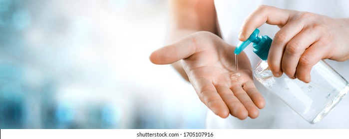 Sanitiser alcohol gel in hands rub clean hand hygiene prevention of coronavirus virus. Man using clear bottle of antibacterial sanitizer liquid soap. Wide banner, copy space for text. - Powered by Shutterstock