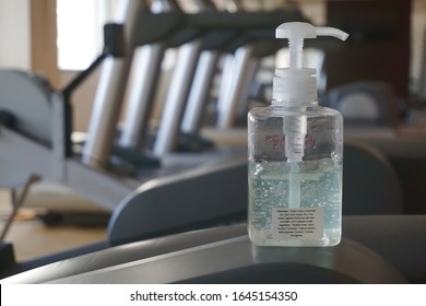 Sanitizer bottle in fitness room , risk area of Covid-19 spreading to public. It is for people to wash hands for killing bacteria , viruses for health safety. Selective focused and blurred background. - Powered by Shutterstock