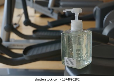 Sanitizer bottle in gym , fitness room. Risk area for disease outbreak , it for washing hands to stop spreading  covid-19 for public health safety. Concept hygiene hands, Gym.                        - Powered by Shutterstock