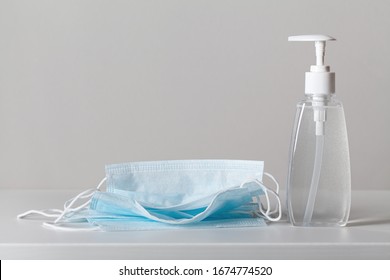 Sanitizer gel or antibacterial soap and face mask for coronavirus preventive measure - Shutterstock ID 1674774520