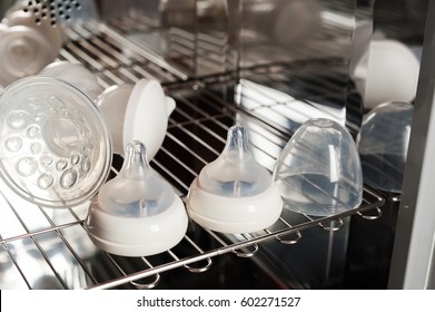 Sanitizing The Baby Things In UV Sterilizer And Dryer, New Technology For Sanitize The Baby Things By UV Light. (Shallow Depth Of Field)