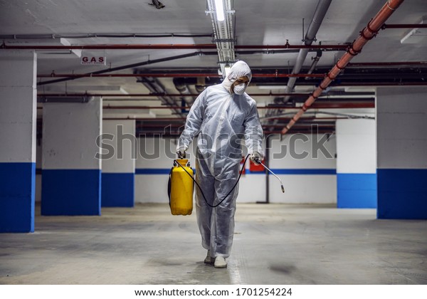 Sanitizing interior surfaces, garage. Cleaning and\
Disinfection inside buildings, the coronavirus epidemic.\
Professional teams for disinfection efforts. Infection prevention\
and control of epidemic.\

