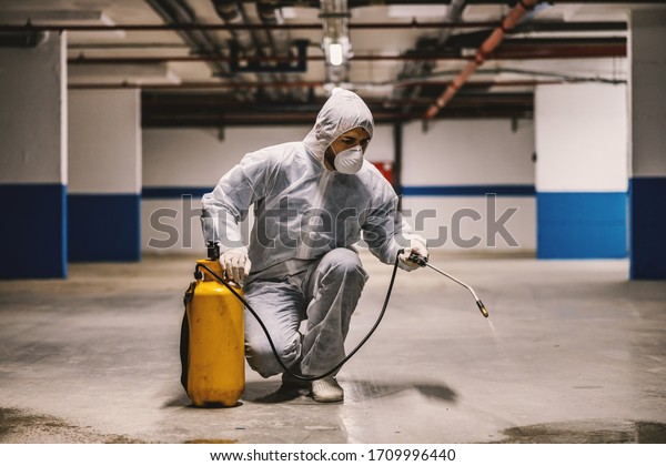 Sanitizing interior surfaces, garage. Cleaning and\
Disinfection inside buildings, the coronavirus epidemic.\
Professional teams for disinfection efforts. Infection prevention\
and control of epidemic.\
