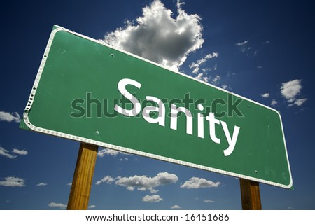 Sanity Road Sign with dramatic clouds and sky.