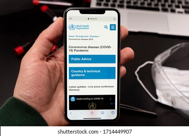 Sank-Petersburg, Russia - April 21 2020: World Health Organization Page On Phone Screen Top View. Covid-19 Or Coronavirus Info On Who.int Website