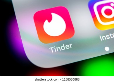 Sankt-Petersburg, Russia, August 10, 2018: Tinder application icon on Apple iPhone X screen close-up. Tinder app icon. Tinder application. Social media icon. Social network. 