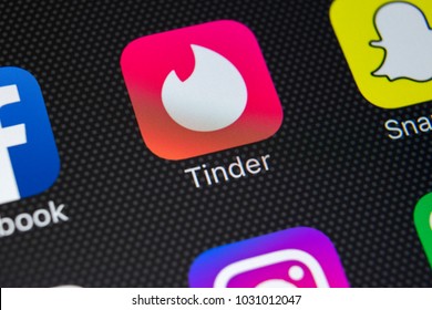 Sankt-Petersburg, Russia, February 22, 2018: Tinder application icon on Apple iPhone X screen close-up. Tinder app icon. Tinder application. Social media icon. Social network. 