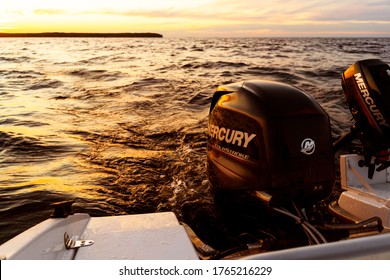 Sankt-Petersburg, Russia, June 22, 2020: Modern New Fishing Sport Boat With A Brand New Mercury FourStroke Outboard Engine On The Lake At The Sunset Or Sunrise