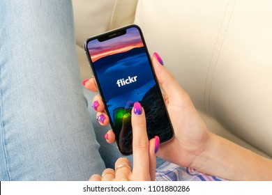 Sankt-Petersburg, Russia, May 30, 2018: Flickr application icon on Apple iPhone X smartphone screen close-up in woman hands. Flickr app icon. Social media icon. Social network