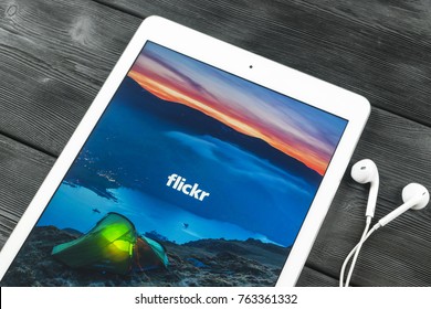 Sankt-Petersburg, Russia, November 23 2017:  Apple iPad Pro with Flickr homepage on monitor screen. Flickr is the video hosting network website. Homepage of Flickr.com on tablet computer.