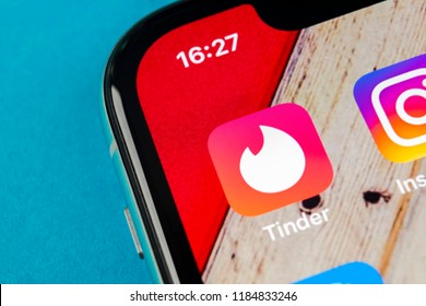 Sankt-Petersburg, Russia, September 19, 2018: Tinder application icon on Apple iPhone X screen close-up. Tinder app icon. Tinder application. Social media icon. Social network. 