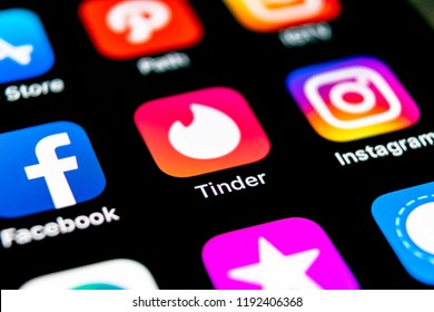 Sankt-Petersburg, Russia, September 30, 2018: Tinder application icon on Apple iPhone X screen close-up. Tinder app icon. Tinder application. Social media icon. Social network. 
