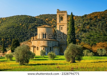 Sant Antimo abbey, olive and cypress trees. Castelnuovo dell'Abate. Tuscany, Italy