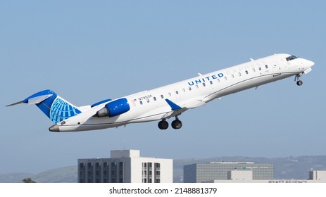 Santa Ana, CA- April 9 2022: A United Express CRJ 700 departing John Wayne Airport. This plane is operated by SkyWest Airlines