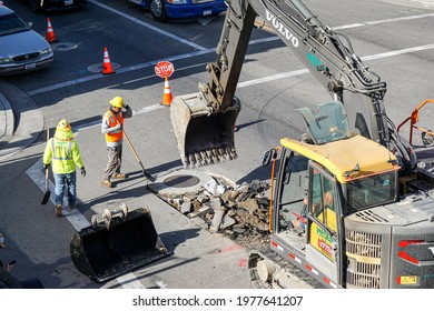 SANTA ANA, CA - MAY 21, 2021: Road Workers Performing Maintenance And Repair On Public Street