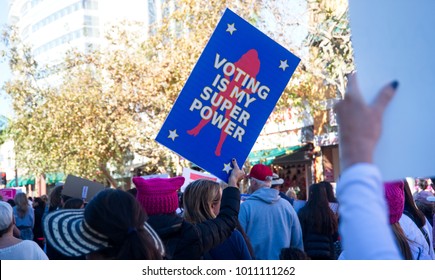 Santa Ana, California - January 20, 2018: Marchers holding political and equality signs at the 2018 Women's March. In hundreds of cities, towns and suburbs in the United States people marched. 