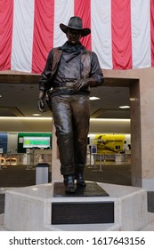 Santa Ana, California / United States - January 16, 2020: Bronze Statue of John Wayne "the Duke" at John Wayne Airport (SNA) by Robert Summers