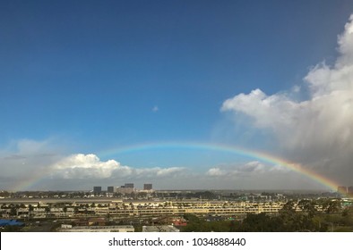 Santa Ana, California USA - February 27, 2018:   A full rainbow emerges after today’s rain over John Wayne Airport, an international airport  in Orange County, California, United States. 