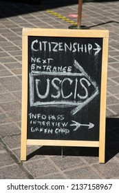 Santa Ana, California - USA - March 13-2022: Citizenship Information Chalk Board On A Sidewalk In Santa Ana California. USCIS Info Pass Interview. Green Card. 