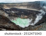 Santa Ana Volcano 
A striking view of a volcanic crater filled with a bright green lake, surrounded by rugged, smoky terrain, showcasing the raw power and geological wonder of this natural phenomenon.