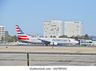 SANTA ANA/CALIFORNIA - AUG. 17, 2015: American Airlines Boeing 737 commercial jet taxiing on runway for a landing at John Wayne International Airport in Santa Ana, California, US