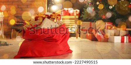 Santa bag with gifts on floor in living room