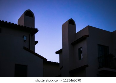Santa Barbara, CA - June 28, 2018: Silhouette Of Spanish Colonial Revival Architecture Featured Against Blue California Skies At Dusk.