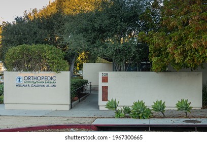 Santa Barbara, CA, USA - February 22, 2021: Early morning light on front facade and entrance of Orthopedic Institute. Beige walls, green foliage and doctor name.