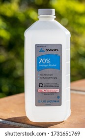 SANTA BARBARA, CA, USA - MAY 9,2020:  Isopropyl Alcohol 70% Swan Brand, First Aid Antiseptic For Rubbing And Massaging Bottle Of 32oz.